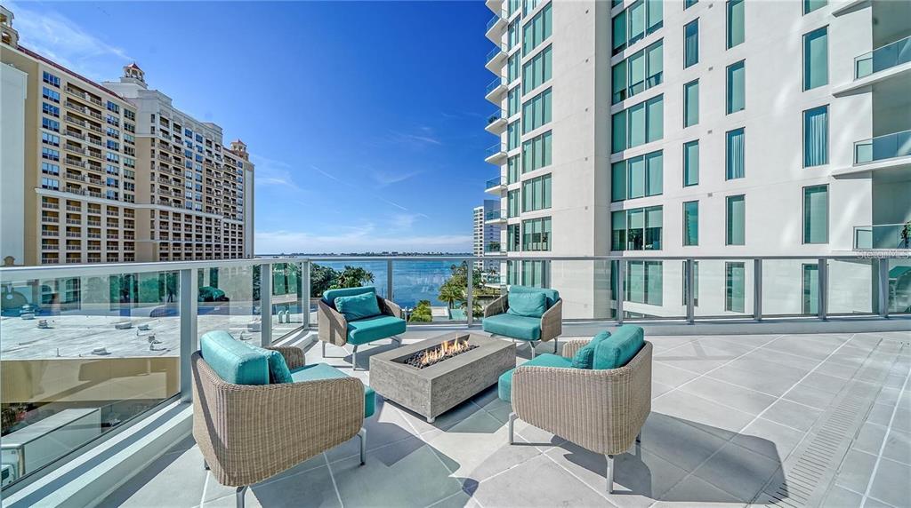 301 Quay Commons, Unit 1011 Sarasota, FL 34236 - Photo 72 of 75 a view of a building and outdoor seating