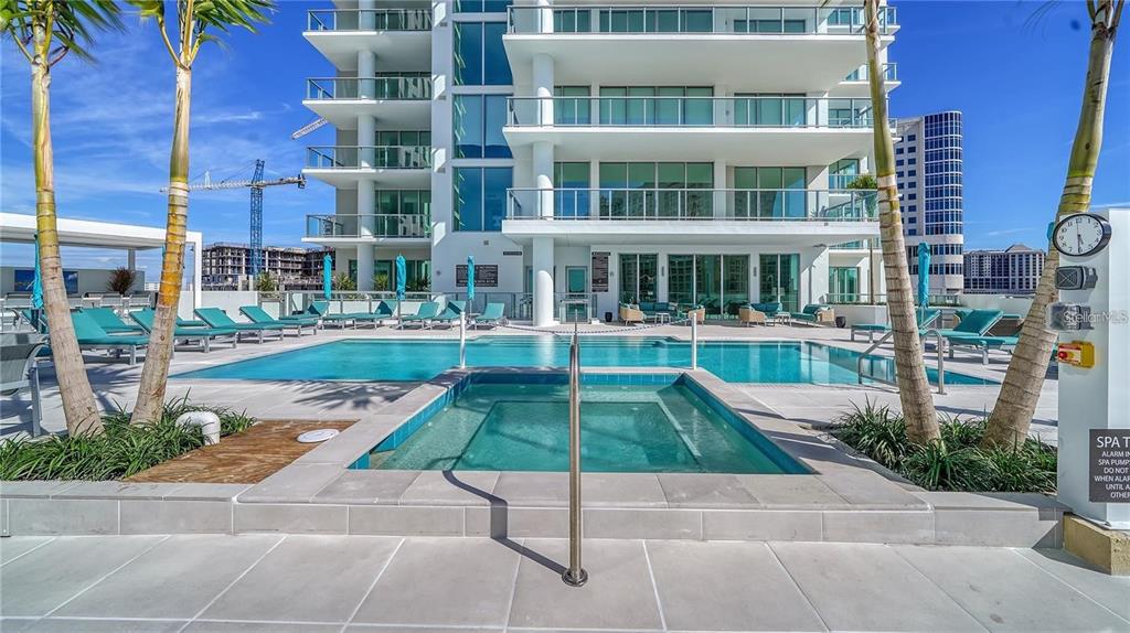 301 Quay Commons, Unit 1011 Sarasota, FL 34236 - Photo 73 of 75 a view of a patio with table and chairs and potted plants