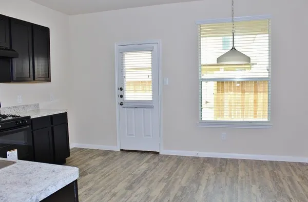 a view of a kitchen that shows a sink dishwasher and a microwave oven