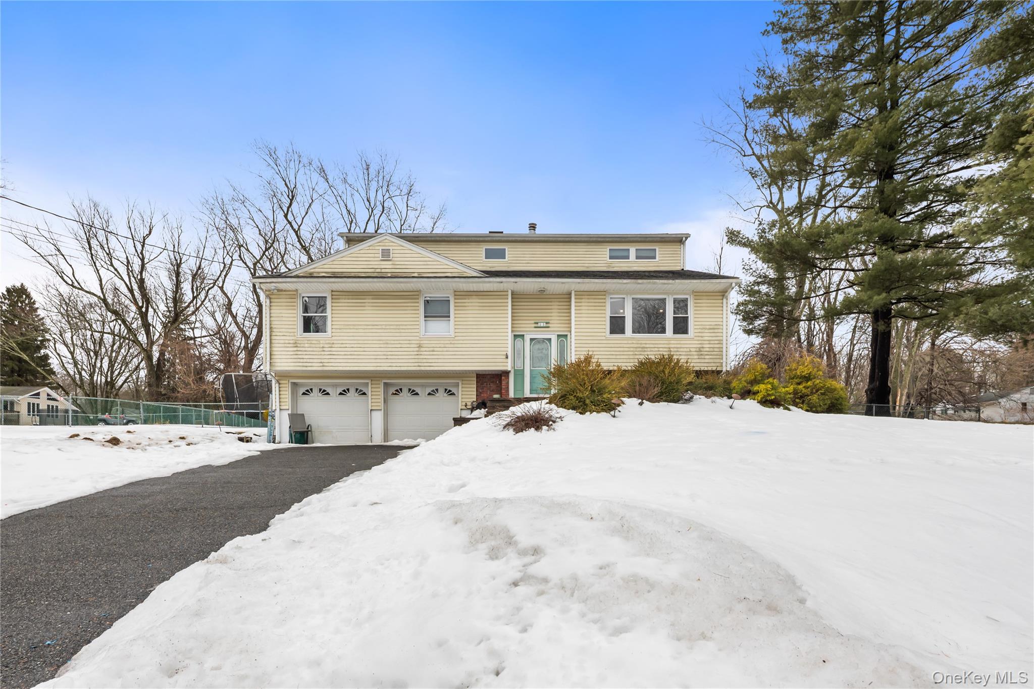11 Castle Drive Chestnut Ridge, NY 10977 - Photo 1 of 34 a front view of a house with a yard