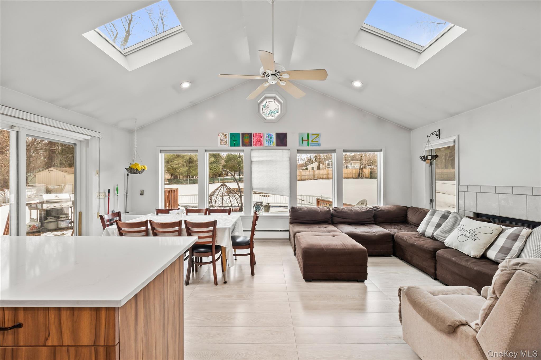 11 Castle Drive Chestnut Ridge, NY 10977 - Photo 12 of 34 a living room with furniture kitchen and a large window