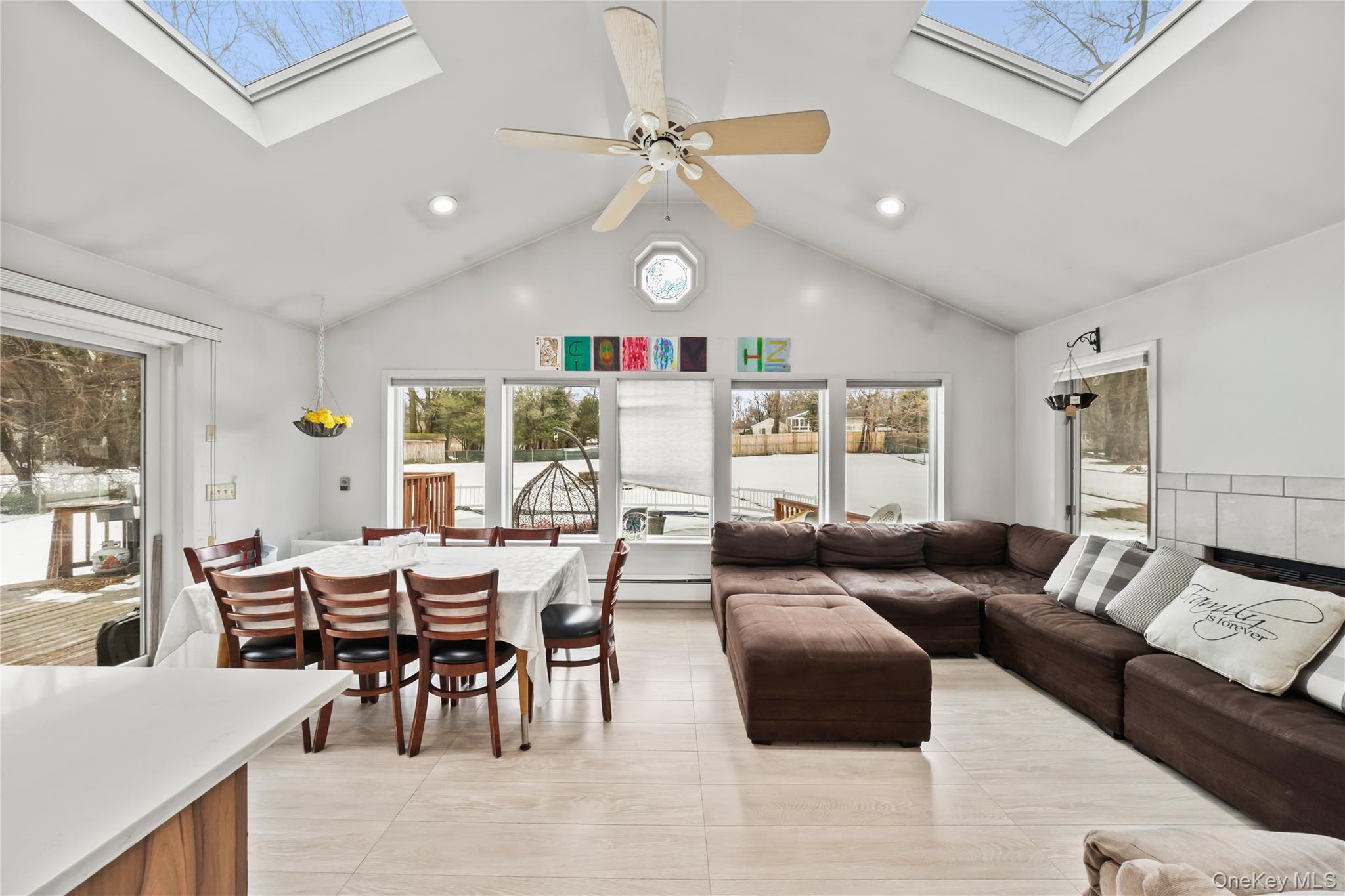 11 Castle Drive Chestnut Ridge, NY 10977 - Photo 13 of 34 a living room with furniture a fireplace and a large window
