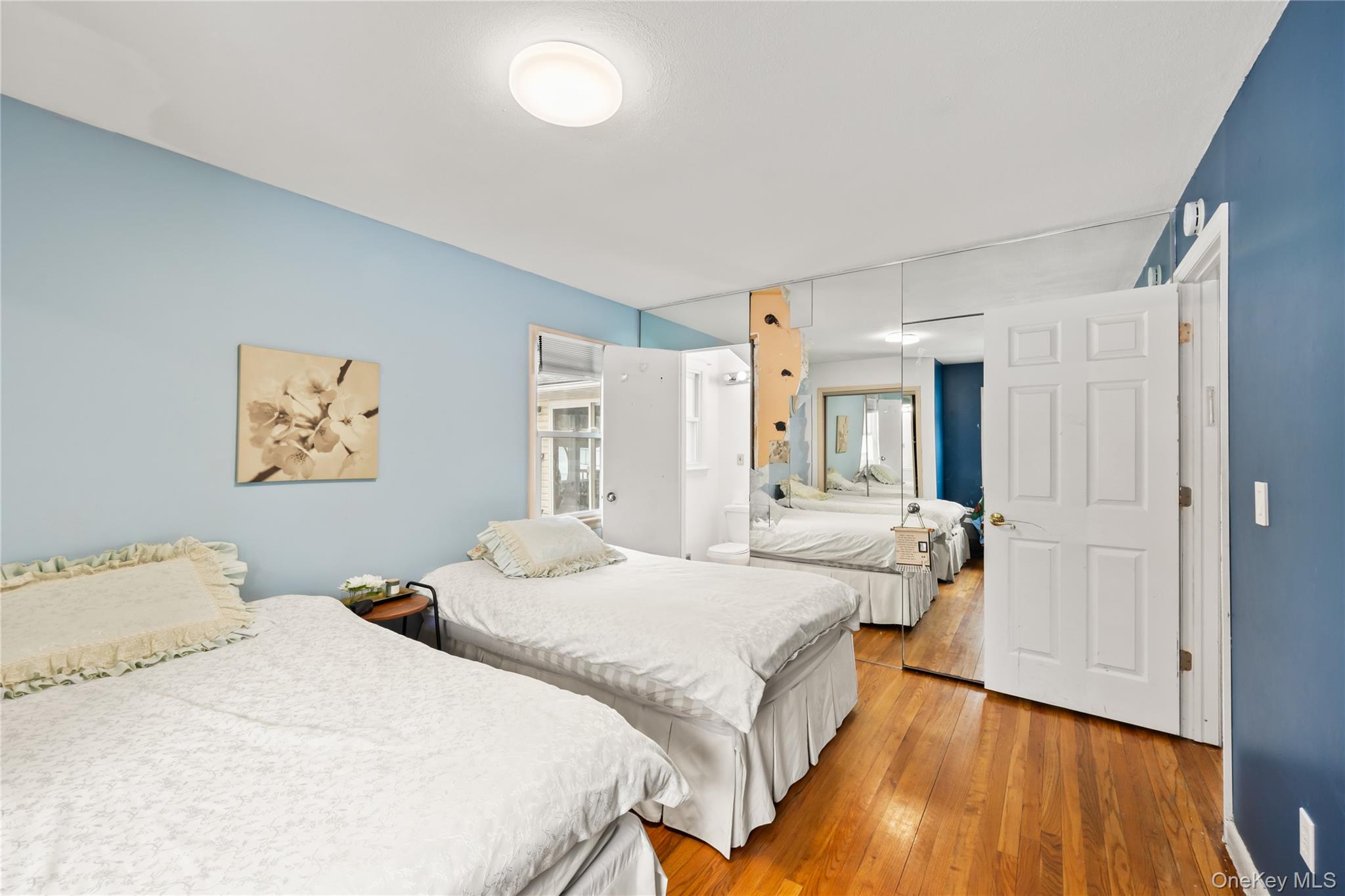 11 Castle Drive Chestnut Ridge, NY 10977 - Photo 19 of 34 a bedroom with a bed and wooden floor