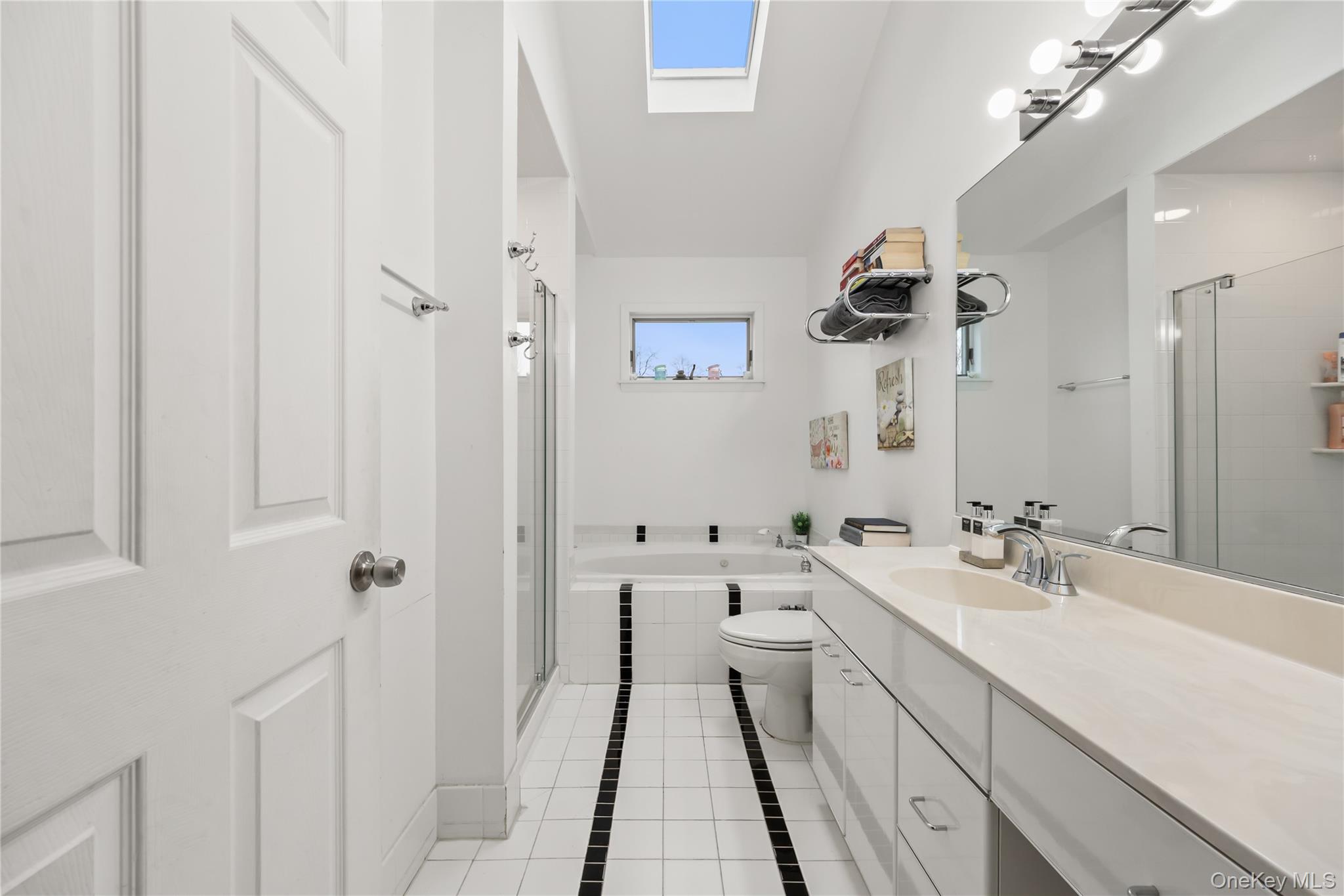 11 Castle Drive Chestnut Ridge, NY 10977 - Photo 27 of 34 a bathroom with a double vanity sink mirror and shower