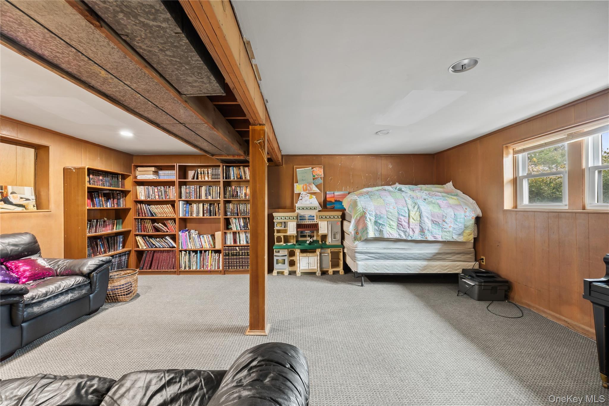 11 Castle Drive Chestnut Ridge, NY 10977 - Photo 31 of 34 a bedroom with furniture and a book shelf