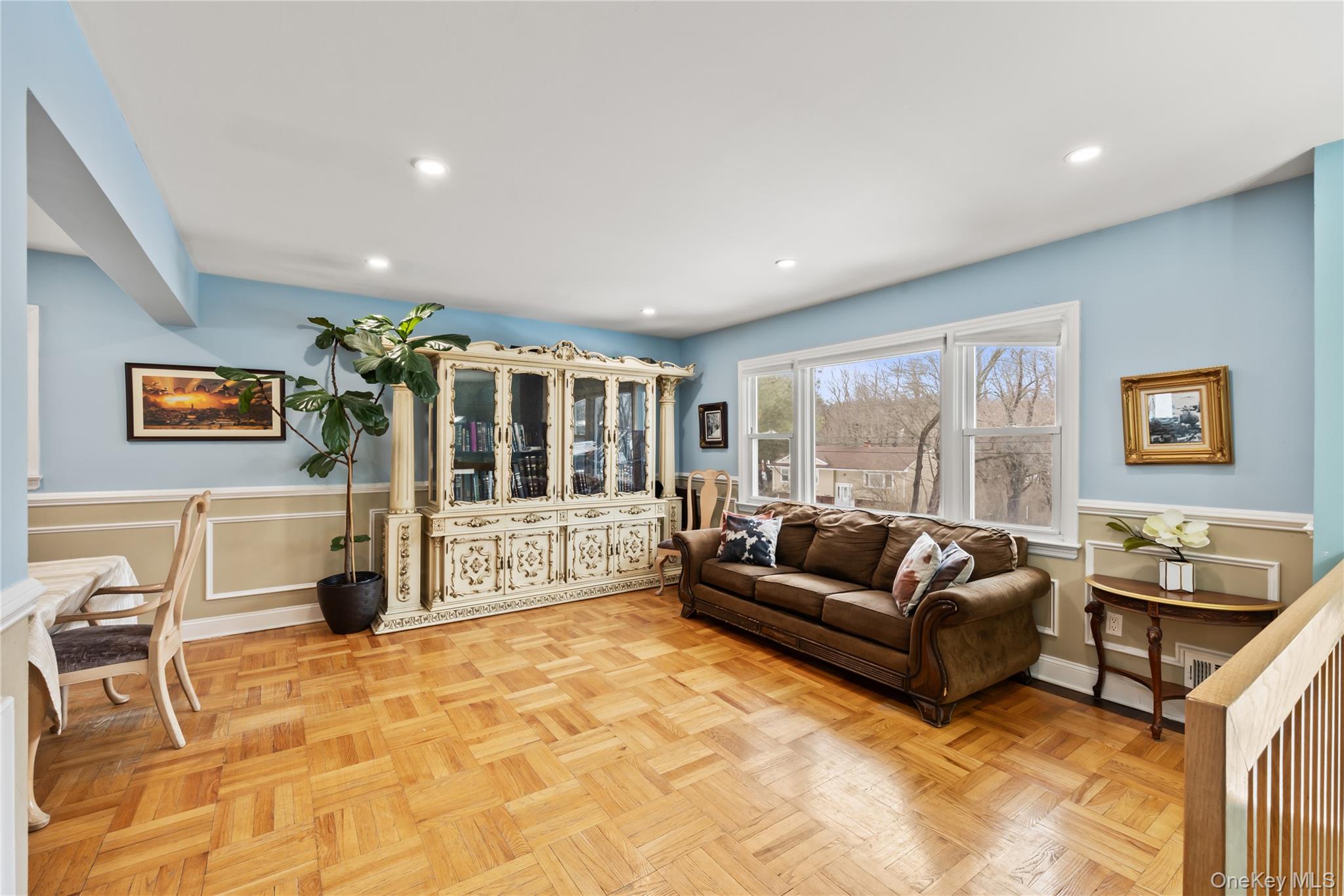 11 Castle Drive Chestnut Ridge, NY 10977 - Photo 4 of 34 a living room with furniture and a flat screen tv