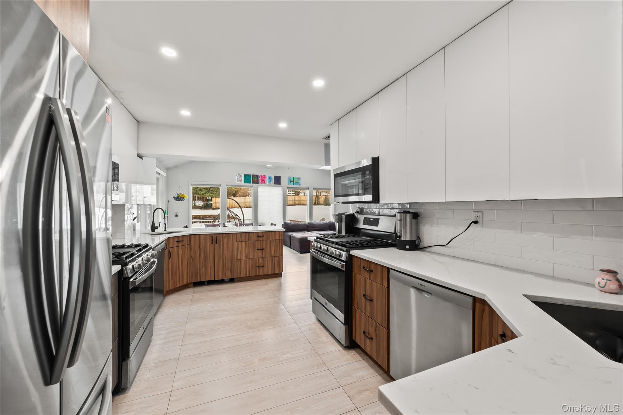 11 Castle Drive Chestnut Ridge, NY 10977 - Photo 7 of 34 a kitchen with stainless steel appliances granite countertop a refrigerator sink and stove