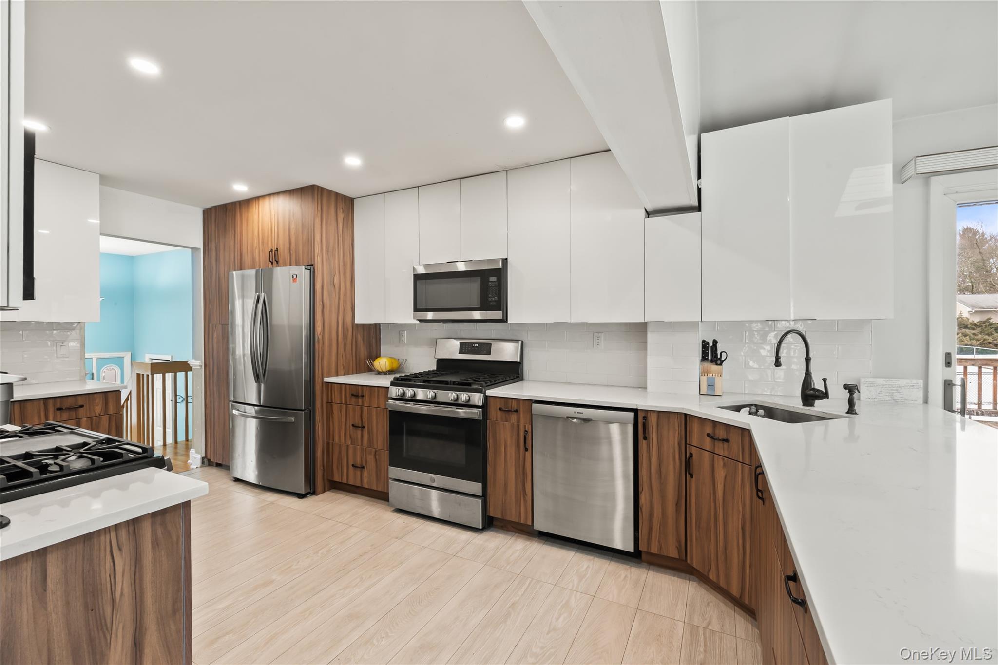 11 Castle Drive Chestnut Ridge, NY 10977 - Photo 8 of 34 a kitchen with stainless steel appliances granite countertop a sink stove and refrigerator