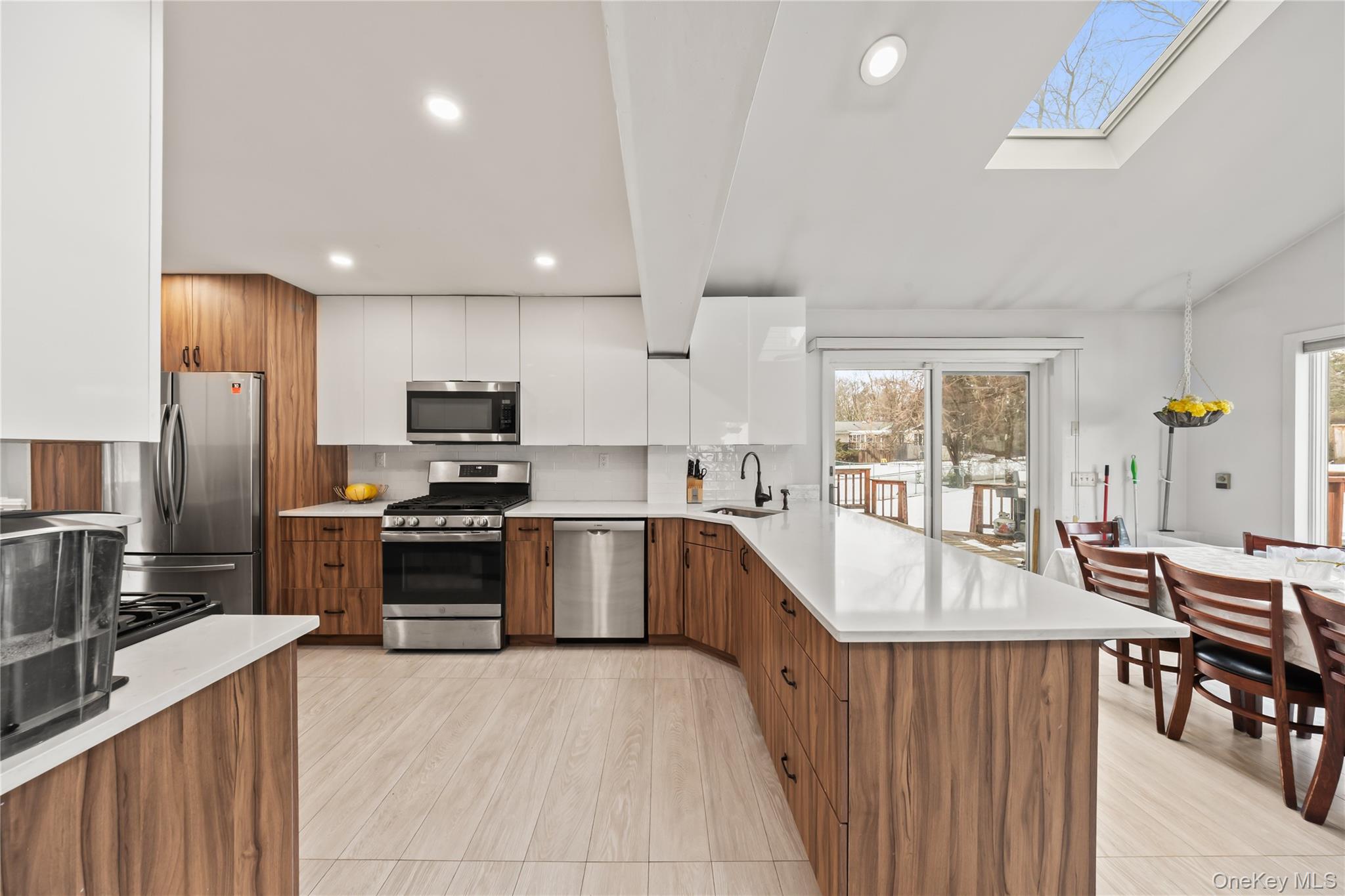 11 Castle Drive Chestnut Ridge, NY 10977 - Photo 9 of 34 a large kitchen with granite countertop a large counter top stainless steel appliances and cabinets