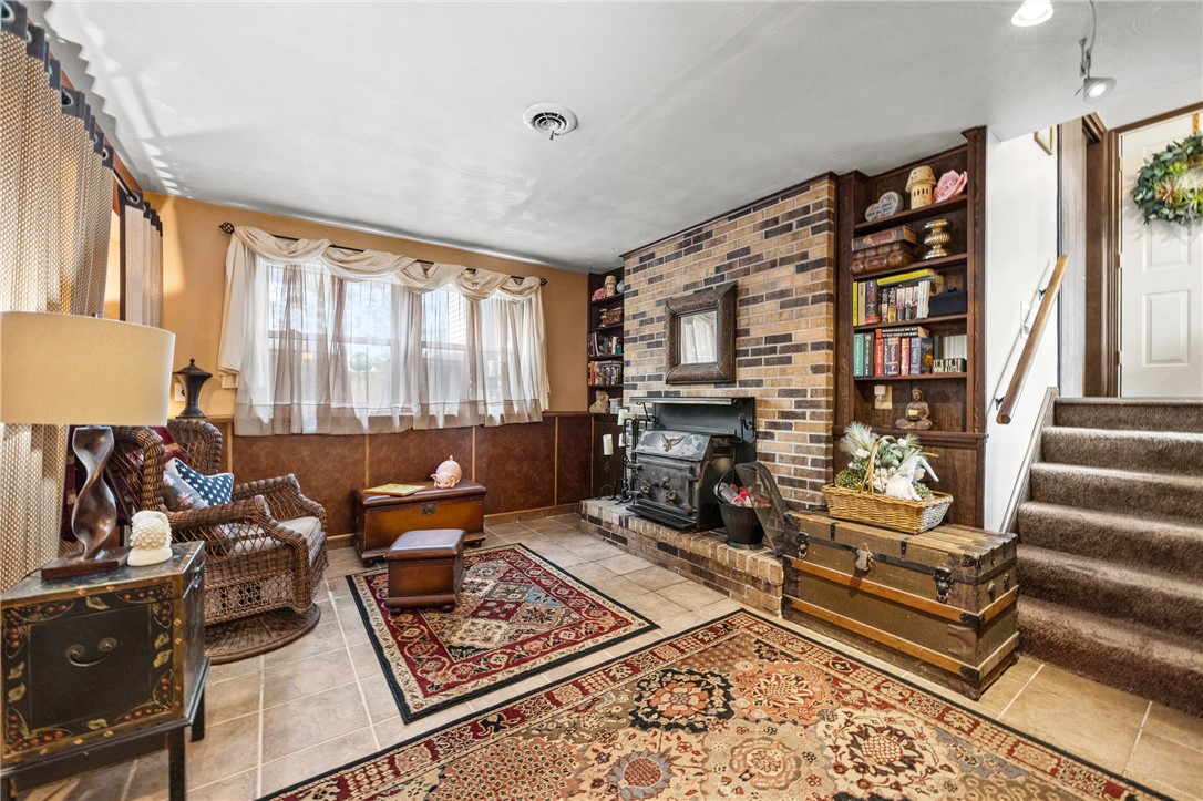 1140 Willits Road Ontario, NY 14519 - Photo 20 of 50 Sitting area in lower level of main house- perfect for reading by the fire!