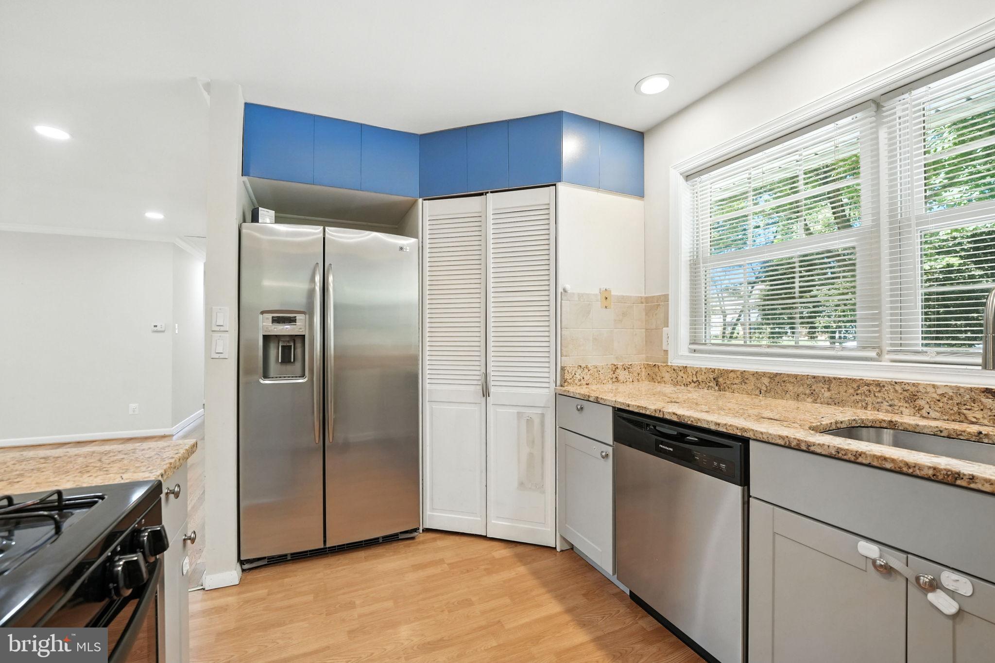 5206 Easton Drive Springfield, VA 22151 - Photo 11 of 39 a kitchen with stainless steel appliances granite countertop a refrigerator and a sink
