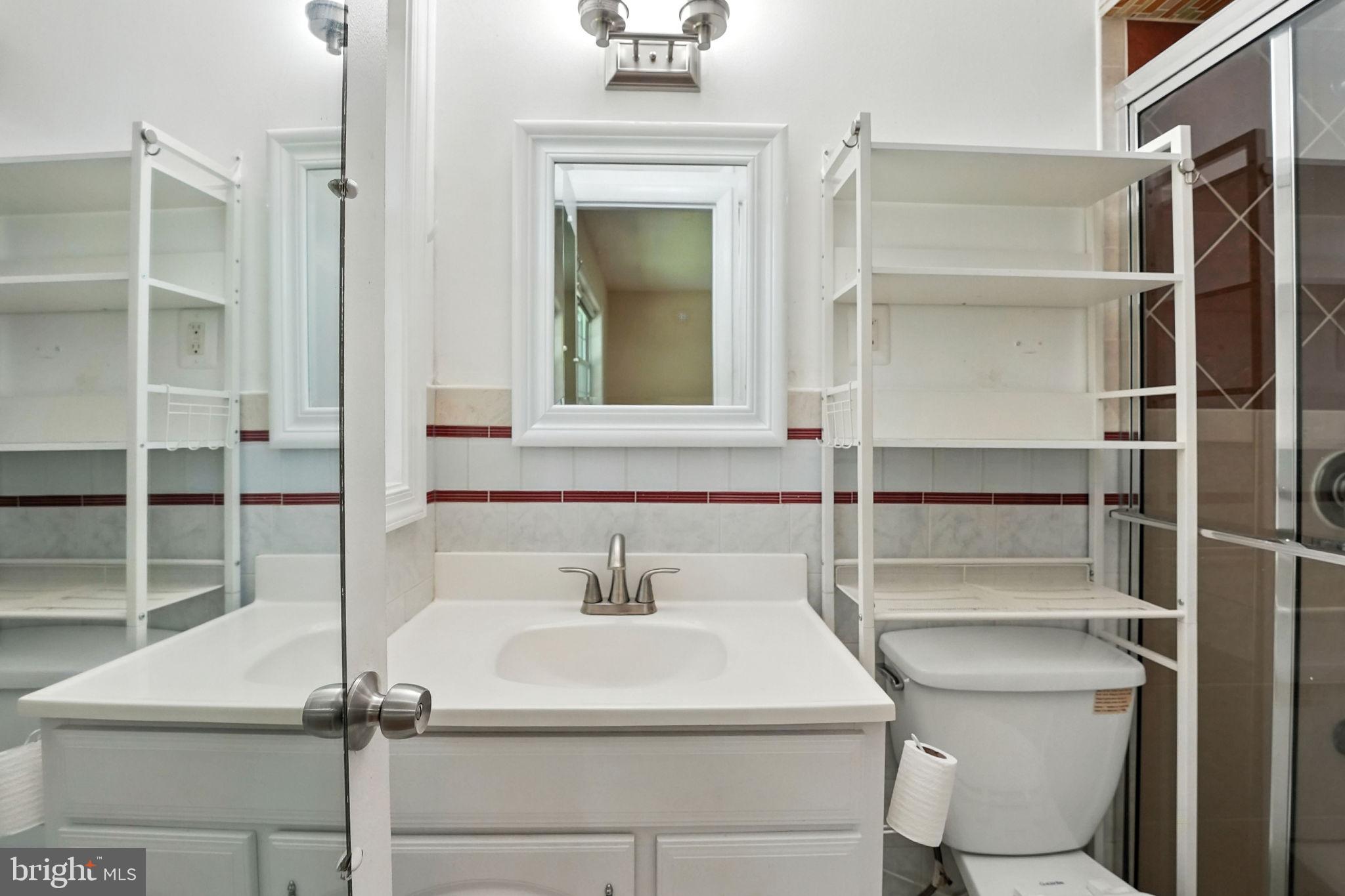 5206 Easton Drive Springfield, VA 22151 - Photo 14 of 39 a bathroom with a sink and a mirror