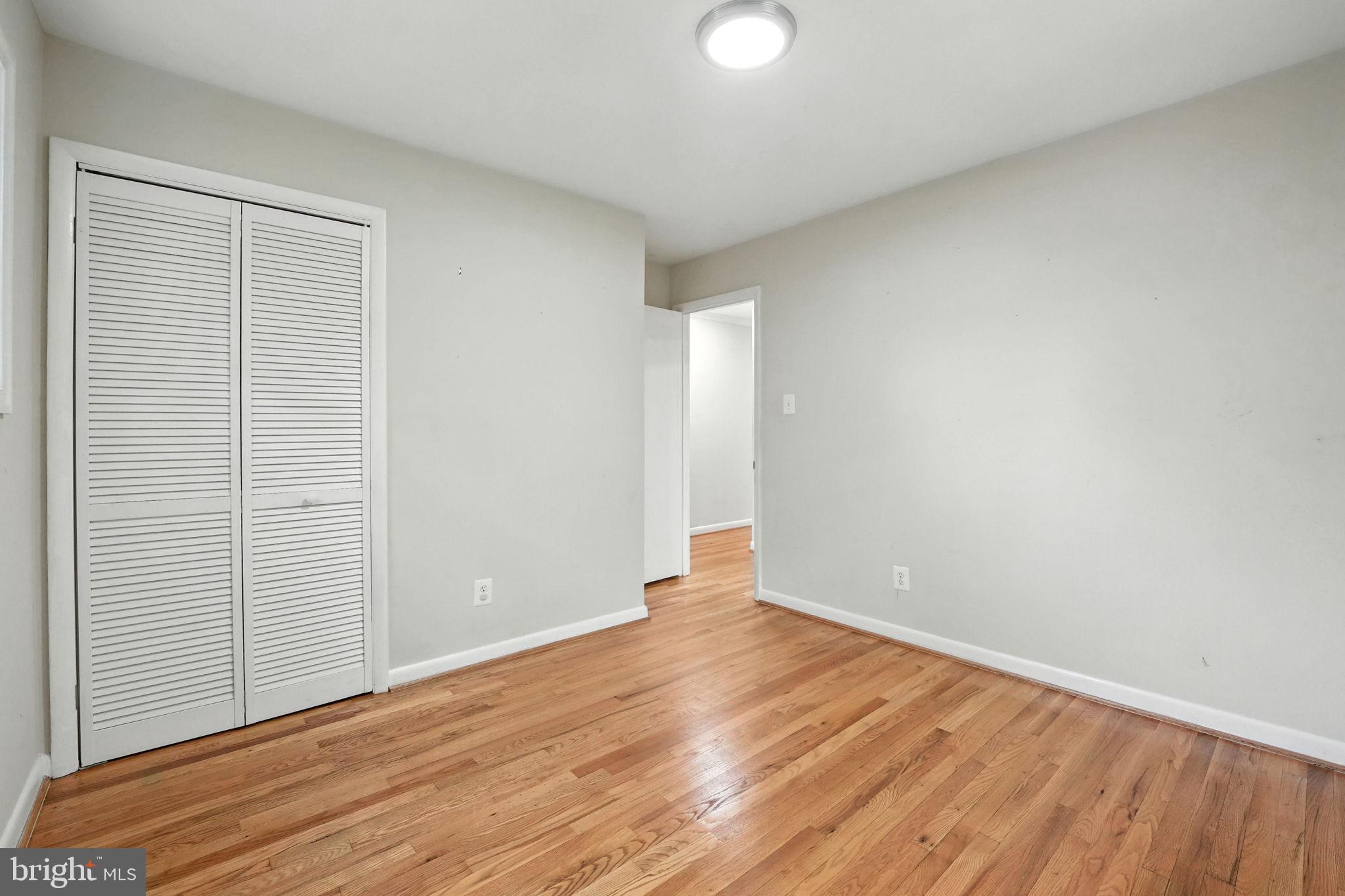 5206 Easton Drive Springfield, VA 22151 - Photo 18 of 39 a view of an empty room with wooden floor