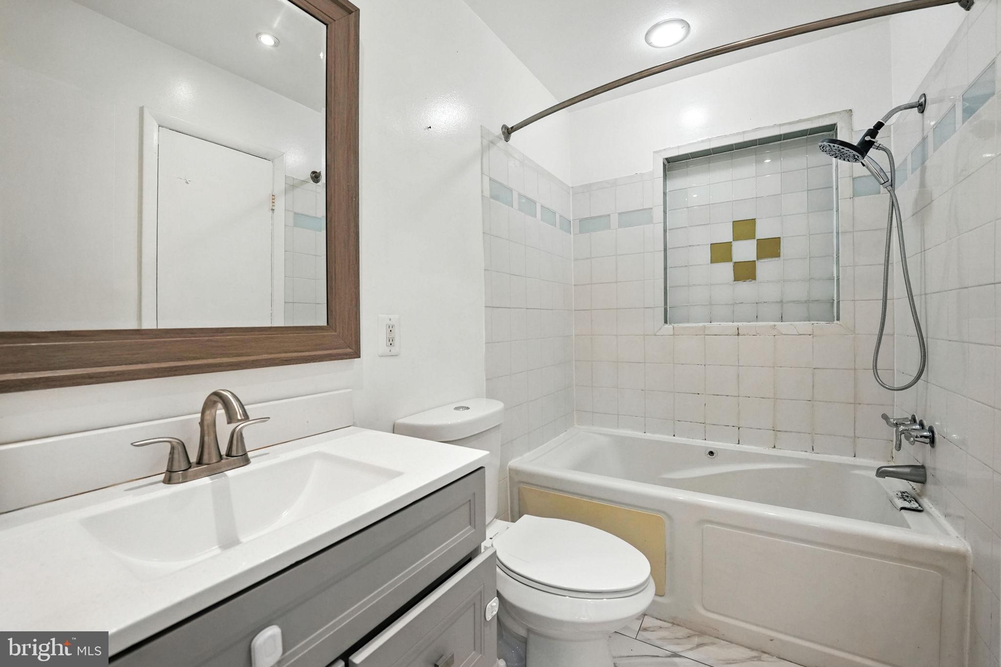 5206 Easton Drive Springfield, VA 22151 - Photo 19 of 39 a bathroom with a sink toilet and shower