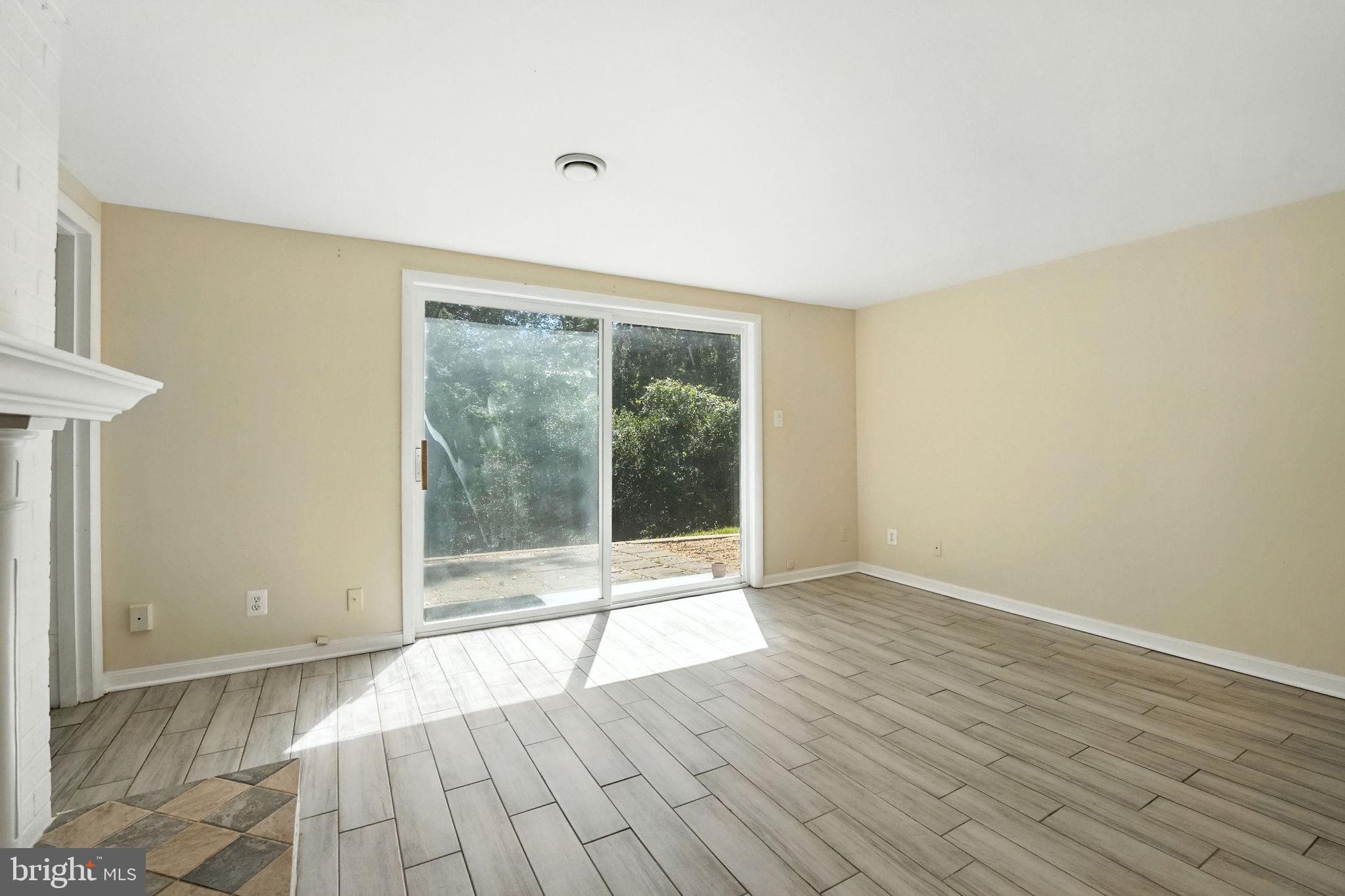 5206 Easton Drive Springfield, VA 22151 - Photo 24 of 39 a view of an empty room with wooden floor and a window