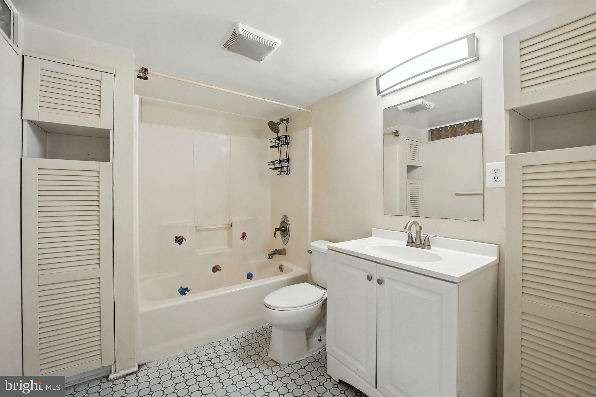 5206 Easton Drive Springfield, VA 22151 - Photo 30 of 39 a bathroom with a sink a toilet and shower