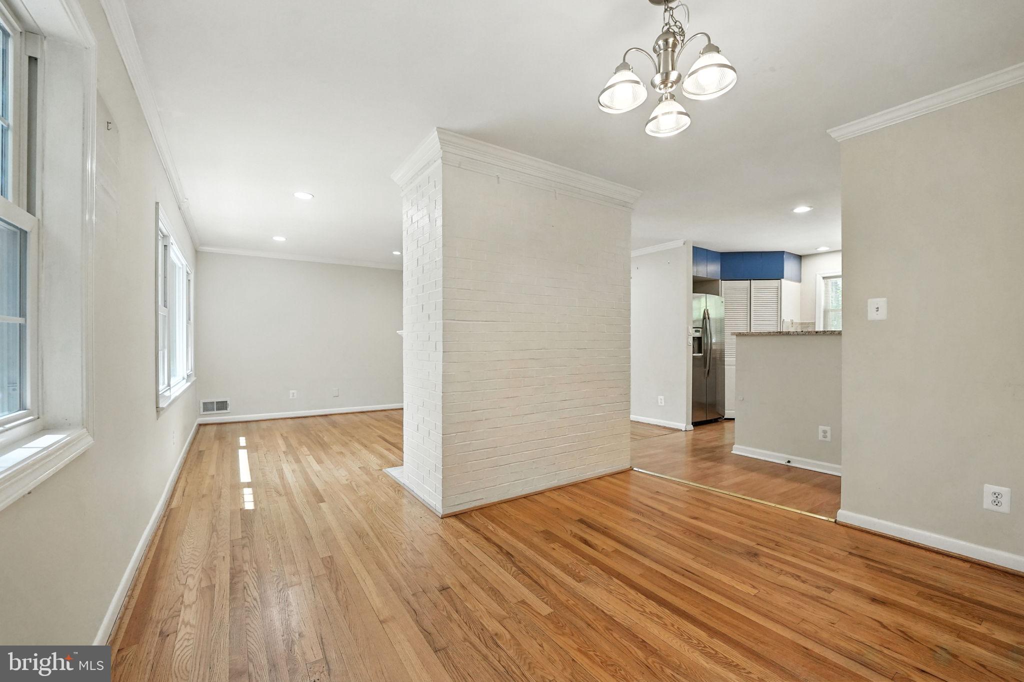 5206 Easton Drive Springfield, VA 22151 - Photo 7 of 39 a view of empty room with wooden floor and window