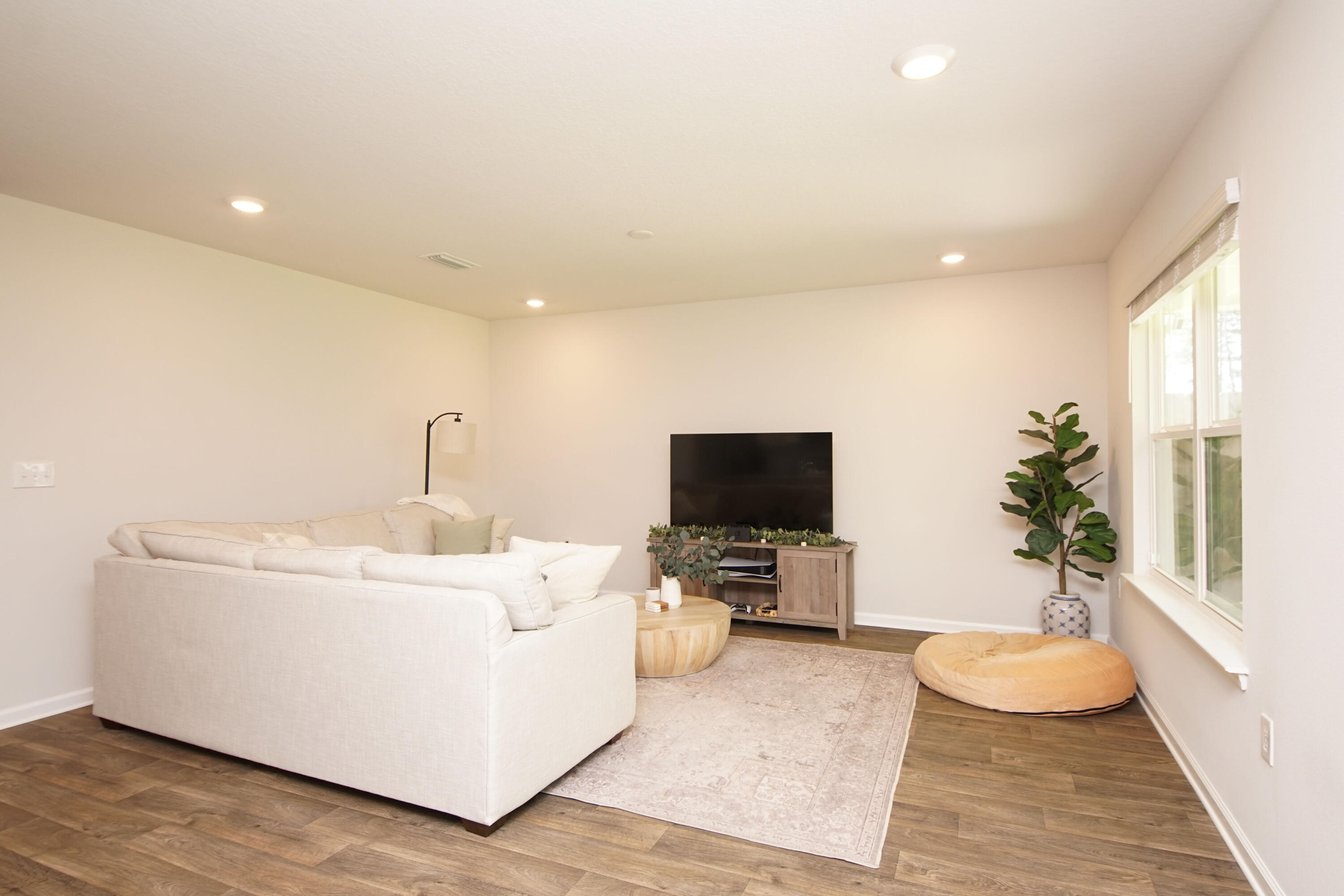 334 This Way Freeport, FL 32439 - Photo 23 of 56 a living room with furniture and a flat screen tv