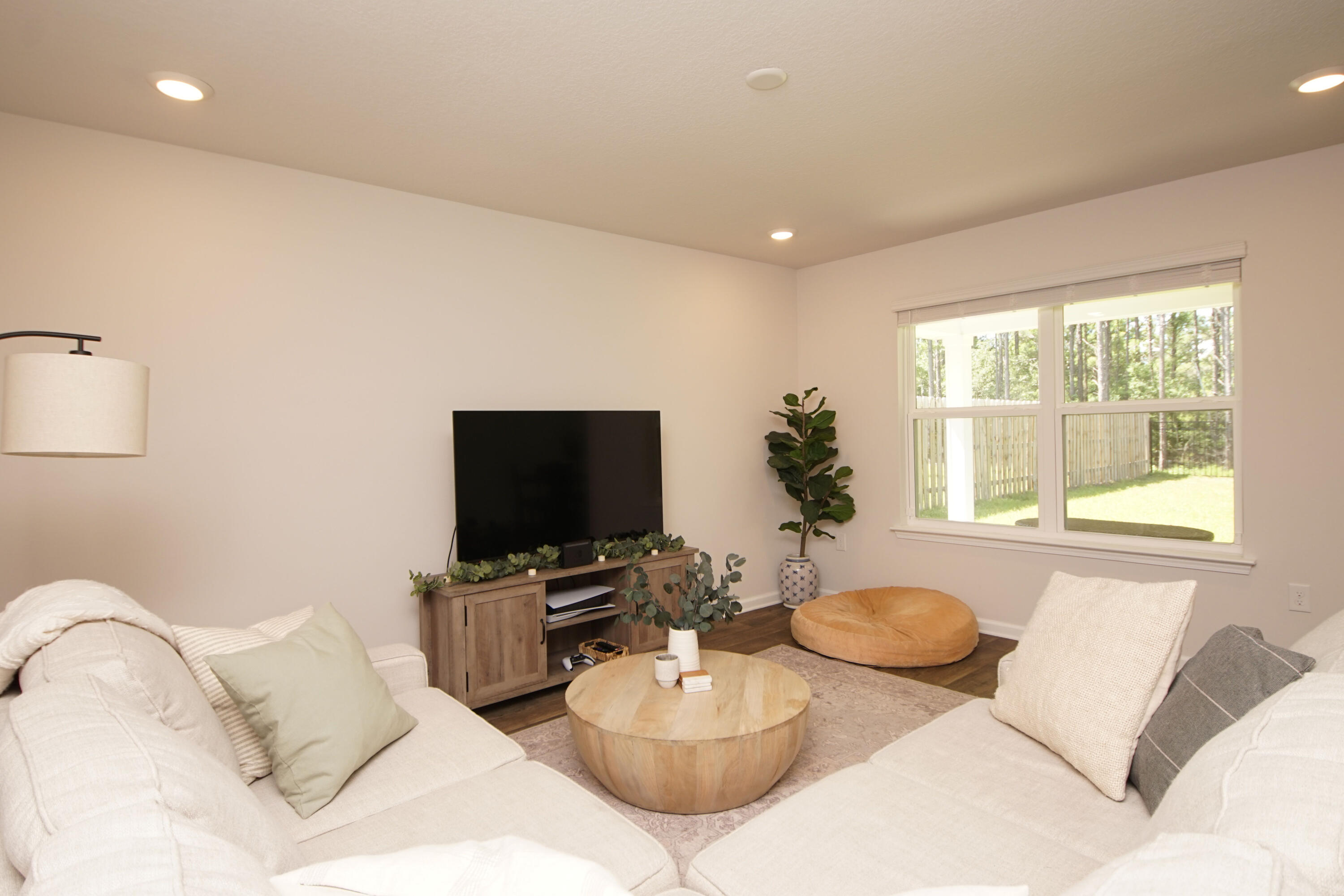 334 This Way Freeport, FL 32439 - Photo 24 of 56 a living room with furniture and a flat screen tv