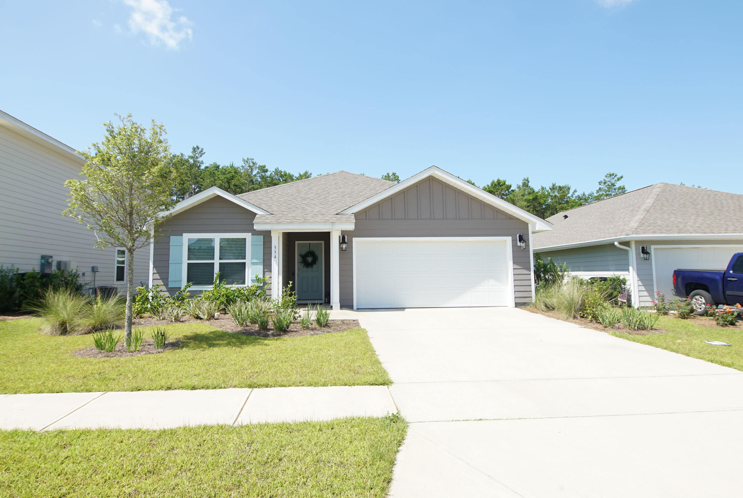 334 This Way Freeport, FL 32439 - Photo 3 of 56 a front view of a house with a yard