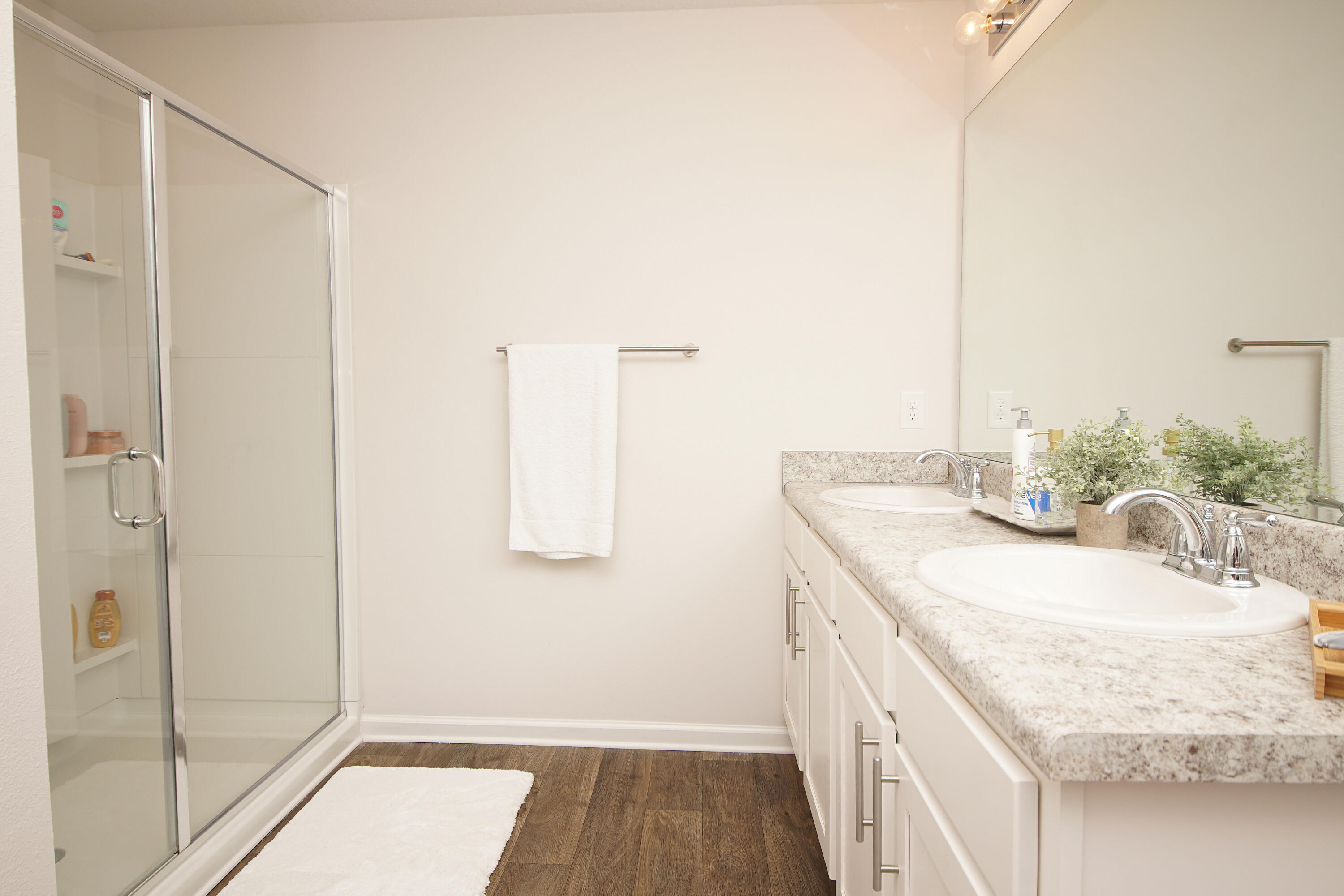 334 This Way Freeport, FL 32439 - Photo 31 of 56 a bathroom with a granite countertop sink a mirror and shower