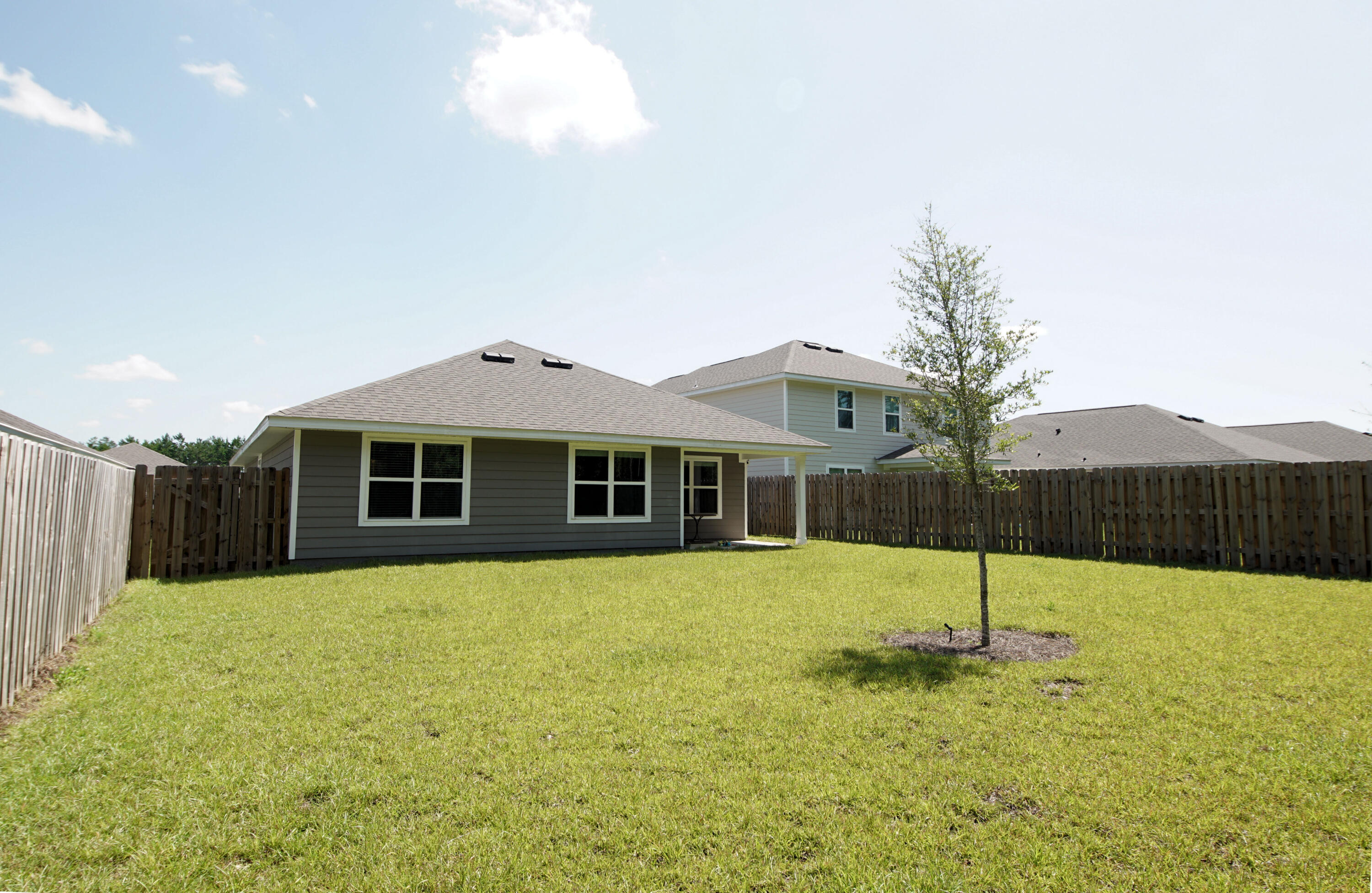334 This Way Freeport, FL 32439 - Photo 43 of 56 a front view of a house with a yard