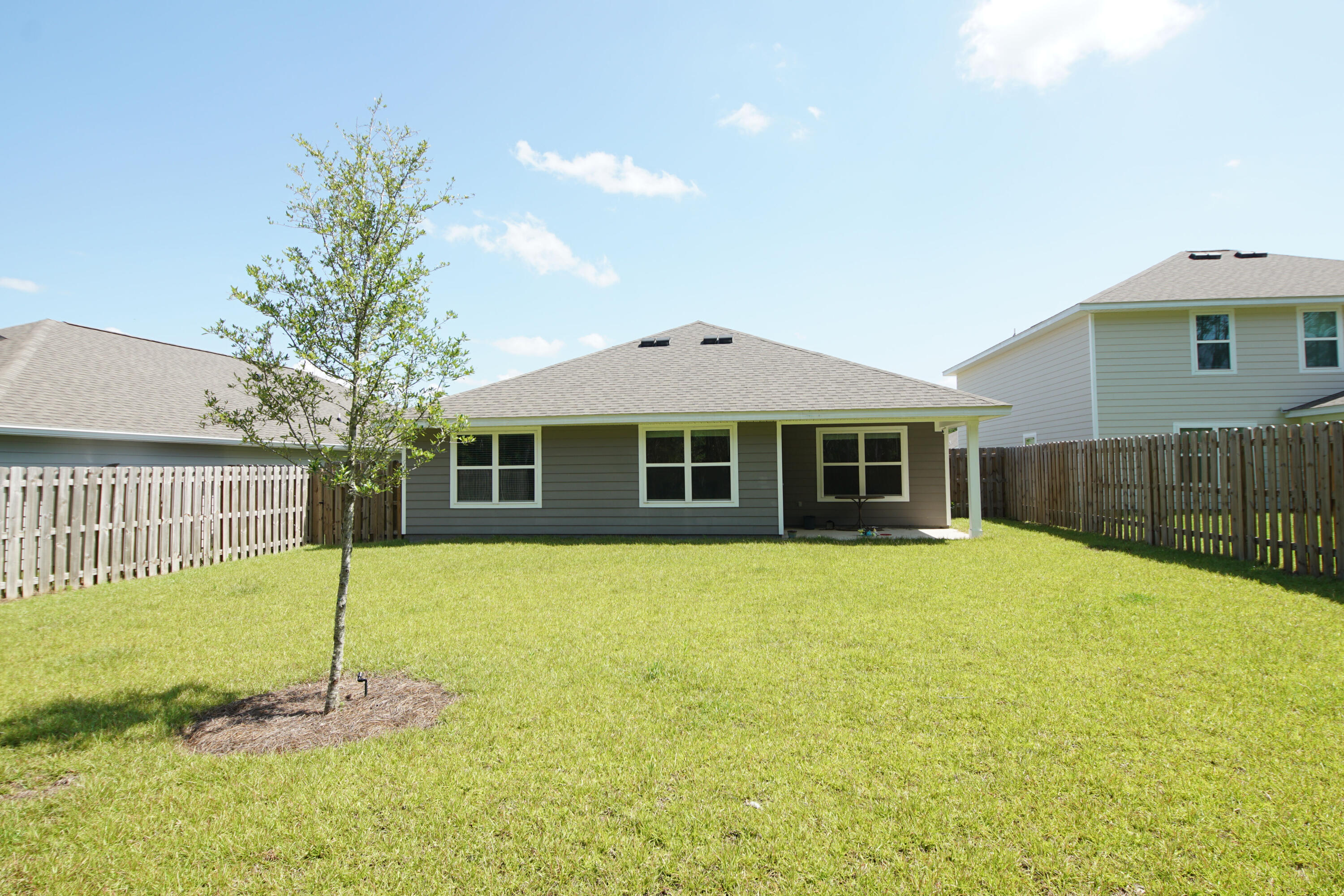 334 This Way Freeport, FL 32439 - Photo 44 of 56 a front view of a house with a yard