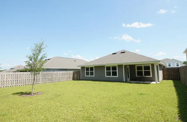 a wooden bench sitting in the middle of a park