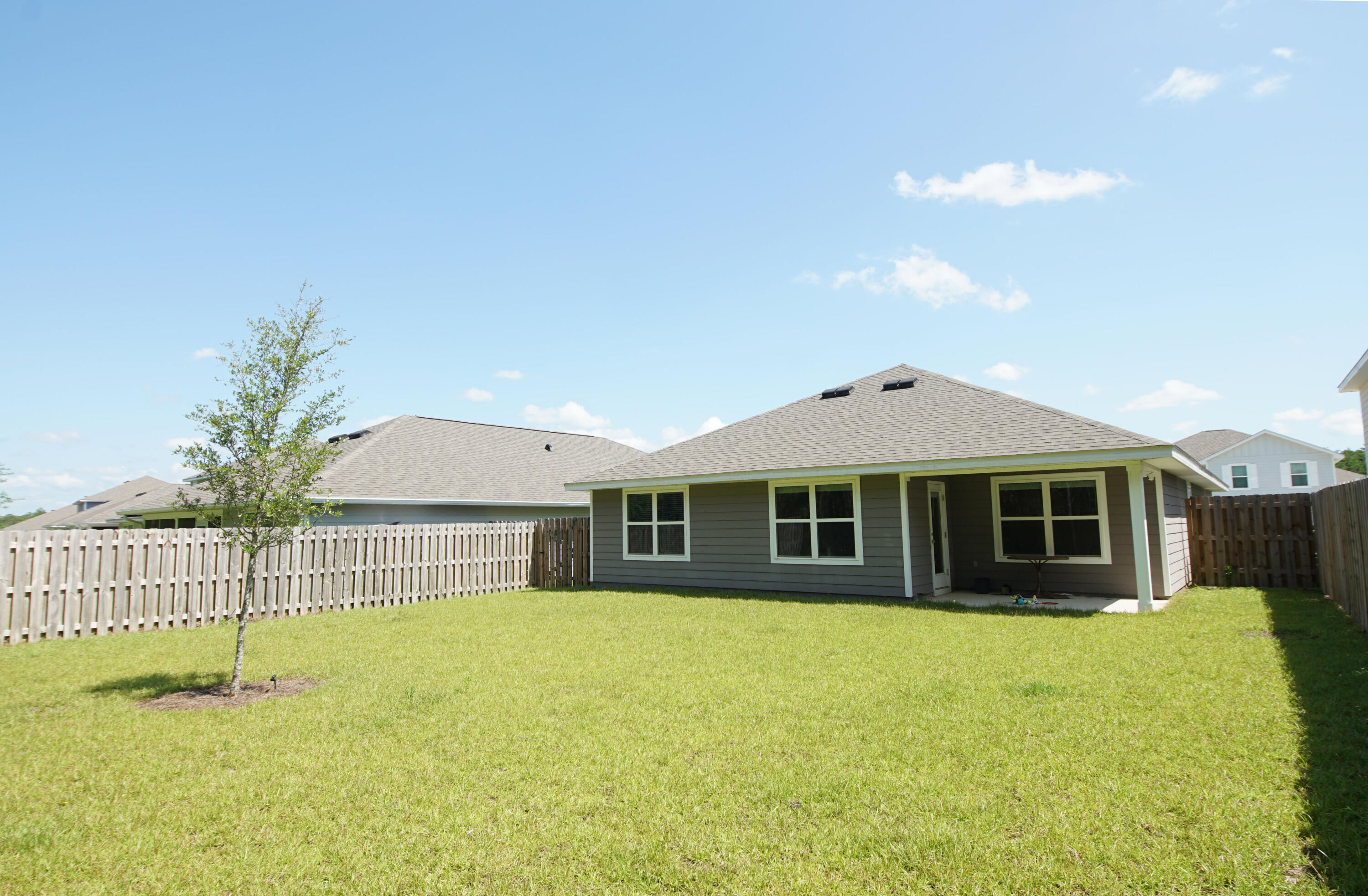 334 This Way Freeport, FL 32439 - Photo 47 of 56 a view of a house with a backyard