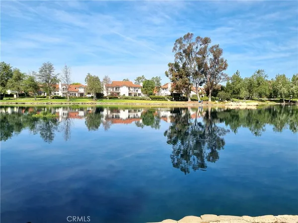 a view of a lake with houses with outdoor space
