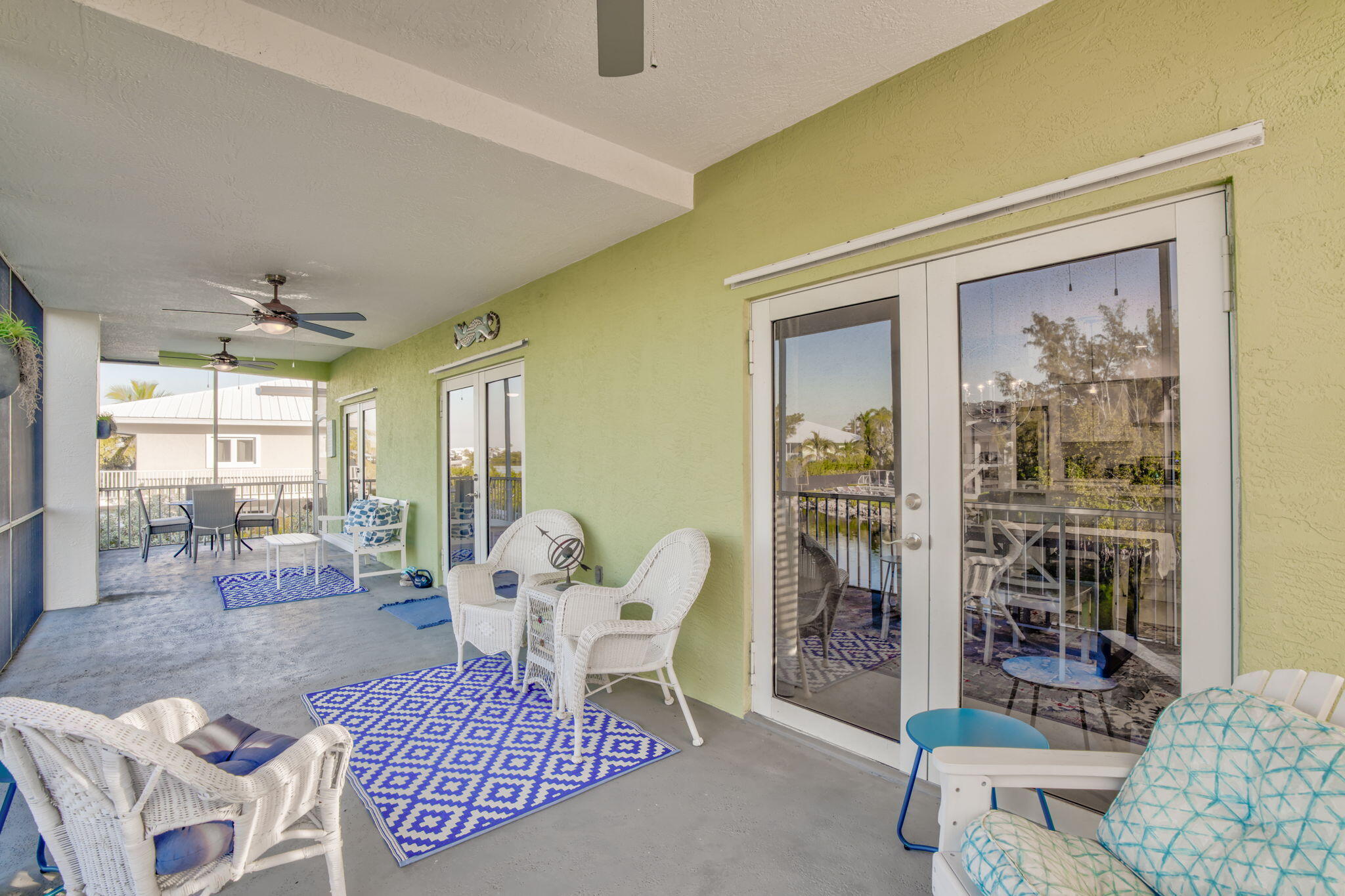 24 Mutiny Place Key Largo, FL 33037 - Photo 14 of 57 a living room with furniture and a floor to ceiling window