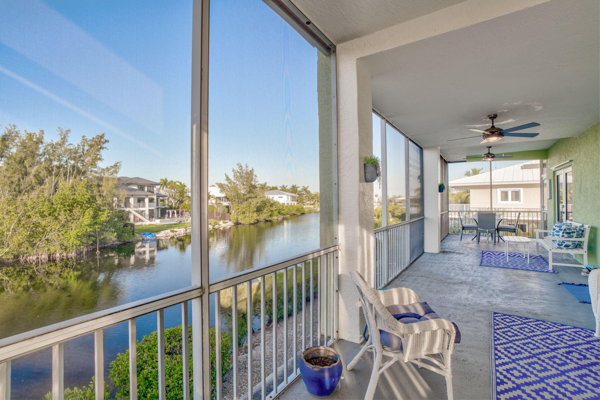 24 Mutiny Place Key Largo, FL 33037 - Photo 15 of 57 a view of a balcony dining table and chairs