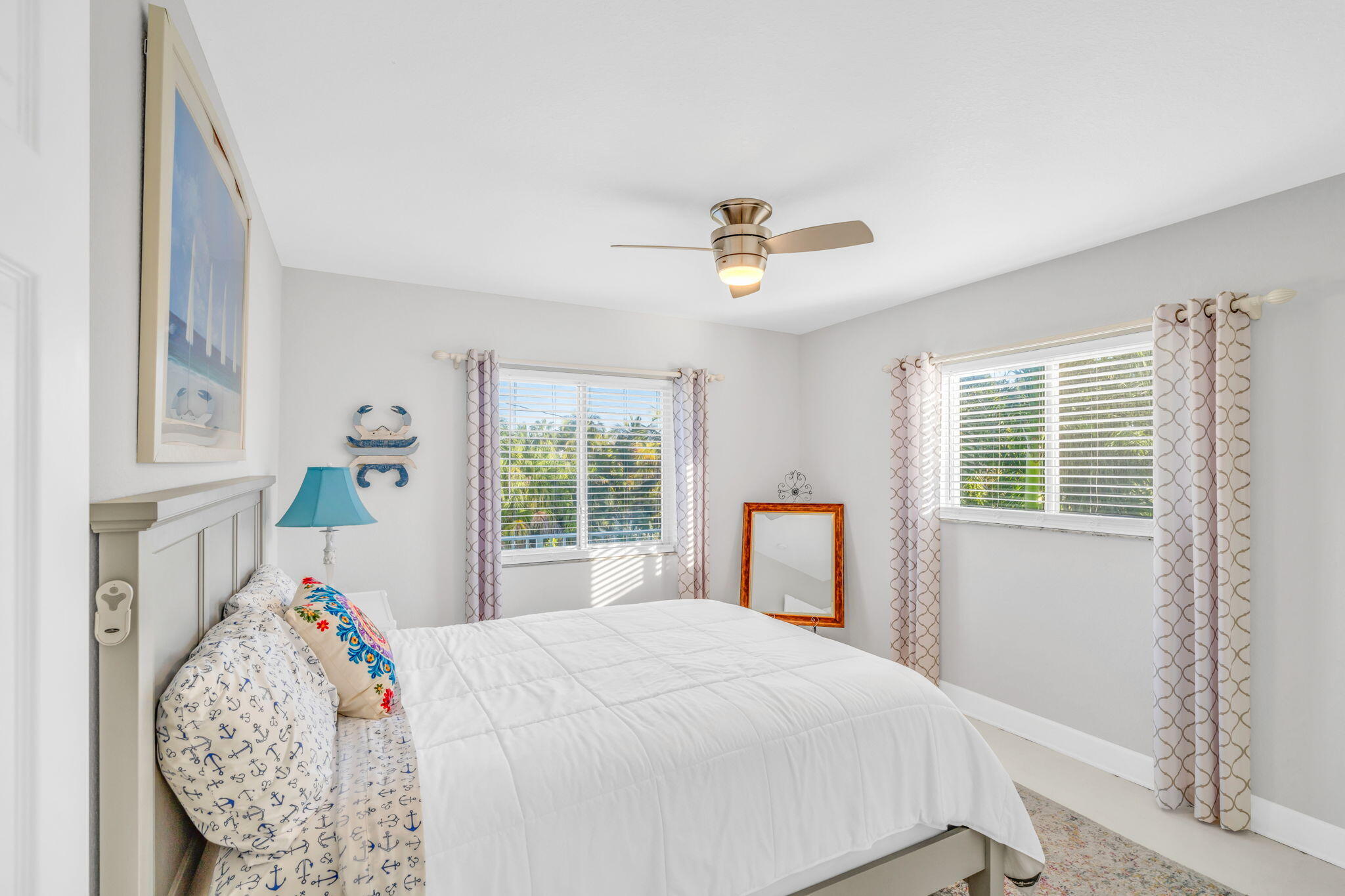 24 Mutiny Place Key Largo, FL 33037 - Photo 18 of 57 a bed sitting in a bedroom next to a window
