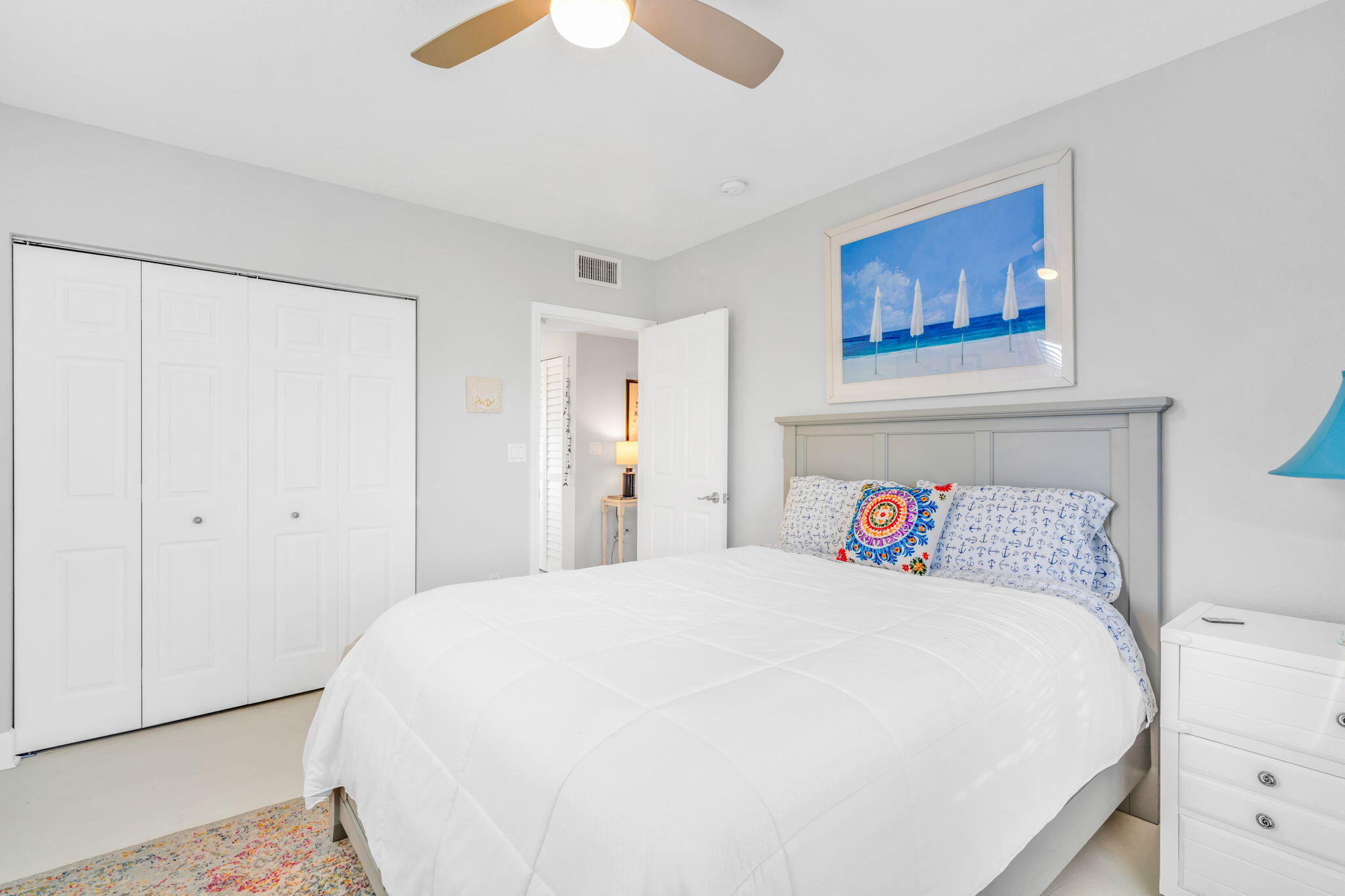 24 Mutiny Place Key Largo, FL 33037 - Photo 19 of 57 a bedroom with a bed and a painting on the wall