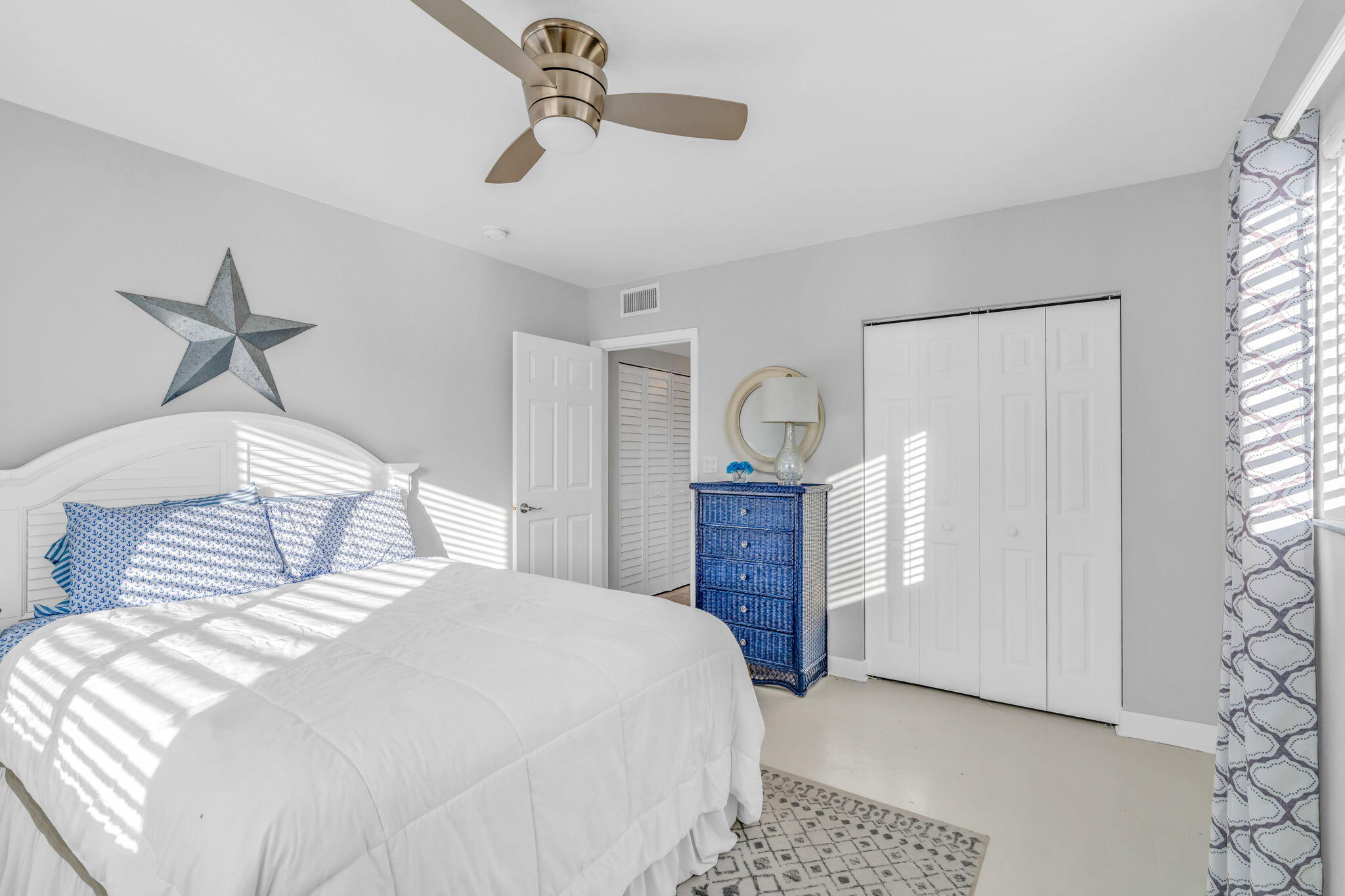 24 Mutiny Place Key Largo, FL 33037 - Photo 23 of 57 a bedroom with a large bed and a chandelier