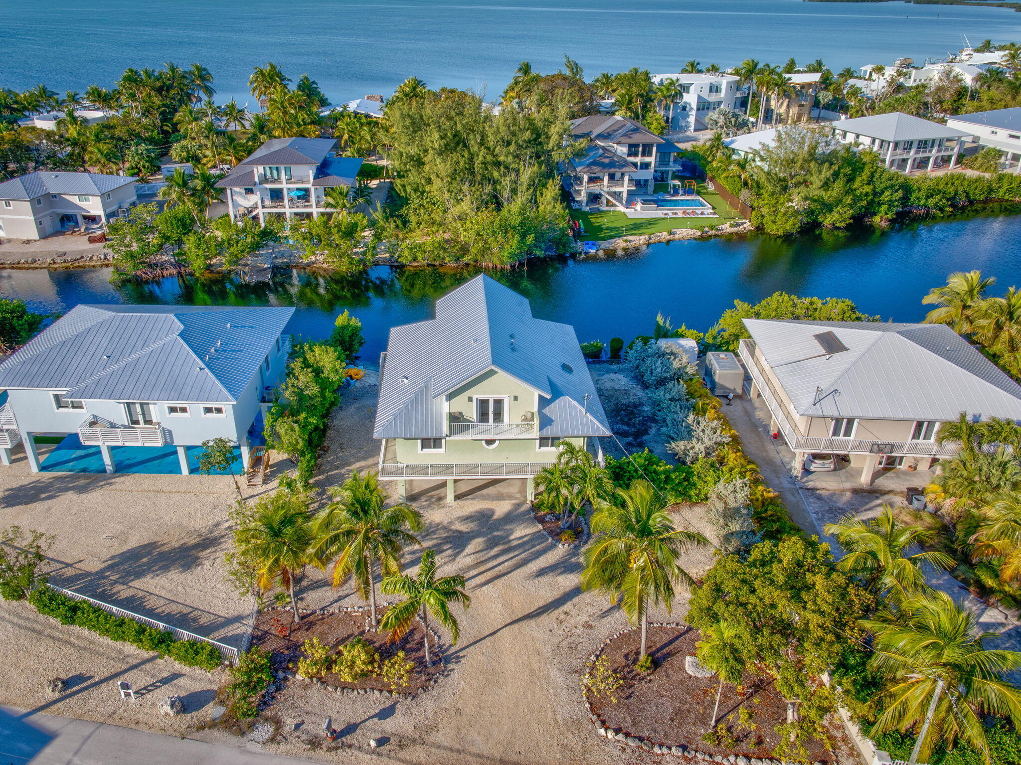 24 Mutiny Place Key Largo, FL 33037 - Photo 42 of 57 an aerial view of a house with a swimming pool outdoor seating and yard