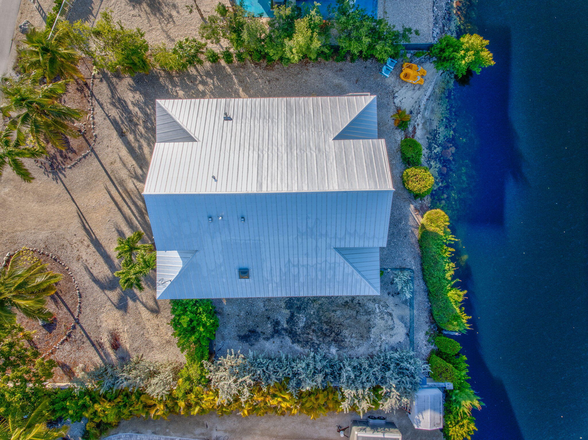 24 Mutiny Place Key Largo, FL 33037 - Photo 43 of 57 a view of a house with a yard and large trees