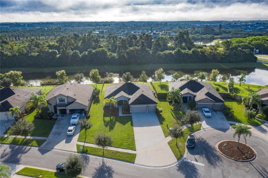 324 Star Shell Drive Apollo Beach, FL 33572 - Photo 1 of 1 an aerial view of house with yard swimming pool and outdoor seating