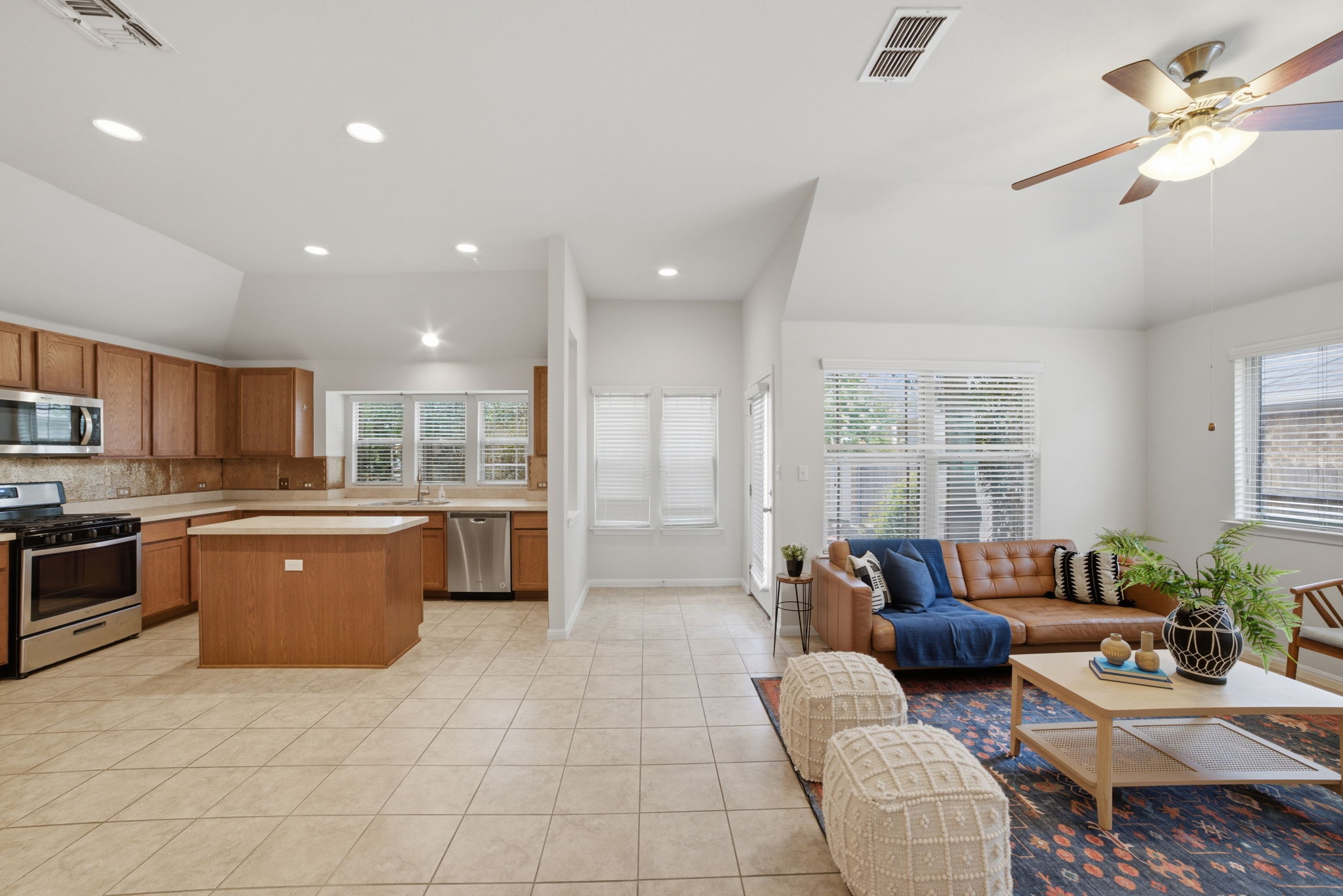 514 Nautical Loop Kyle, TX 78640 - Photo 24 of 24 An open floorplan seamlessly connects the well-appointed kitchen and comfortable living space.