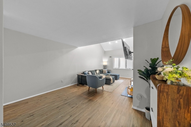23 Bayowski Road West Orange, NJ 07052 - Photo 13 of 38 a living room with furniture and a potted plant
