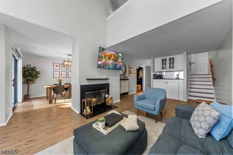 23 Bayowski Road West Orange, NJ 07052 - Photo 17 of 38 a living room with furniture and a fireplace