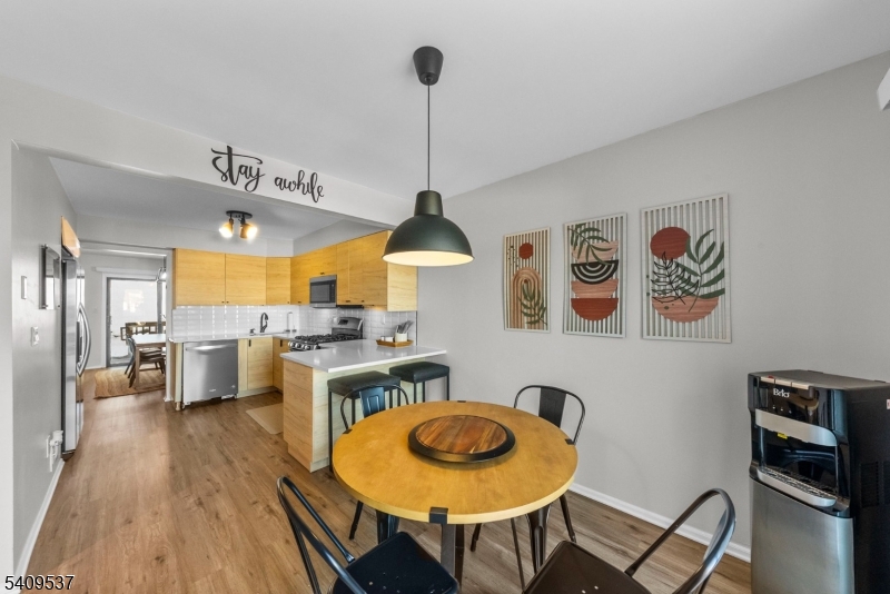 23 Bayowski Road West Orange, NJ 07052 - Photo 3 of 38 a dining room with furniture and wooden floor