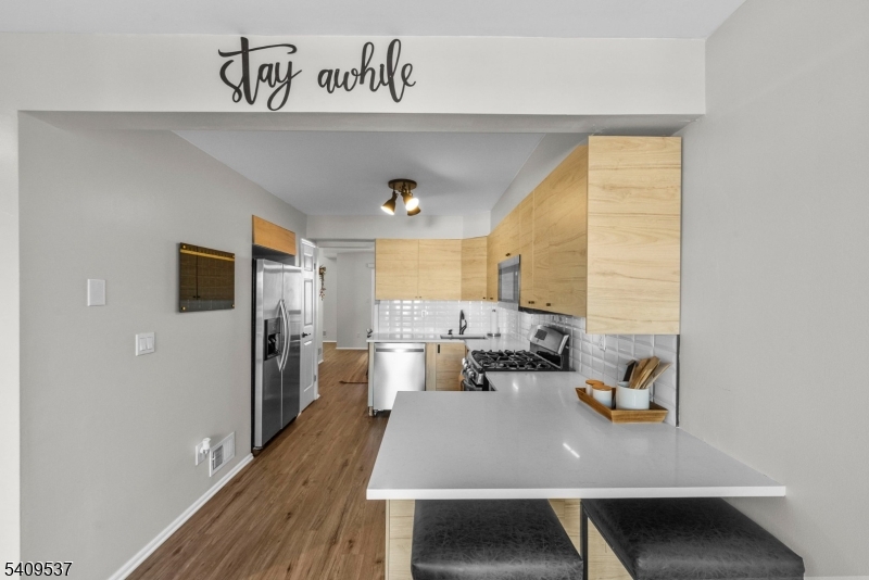 23 Bayowski Road West Orange, NJ 07052 - Photo 5 of 38 a view of a dining room with furniture window and wooden floor