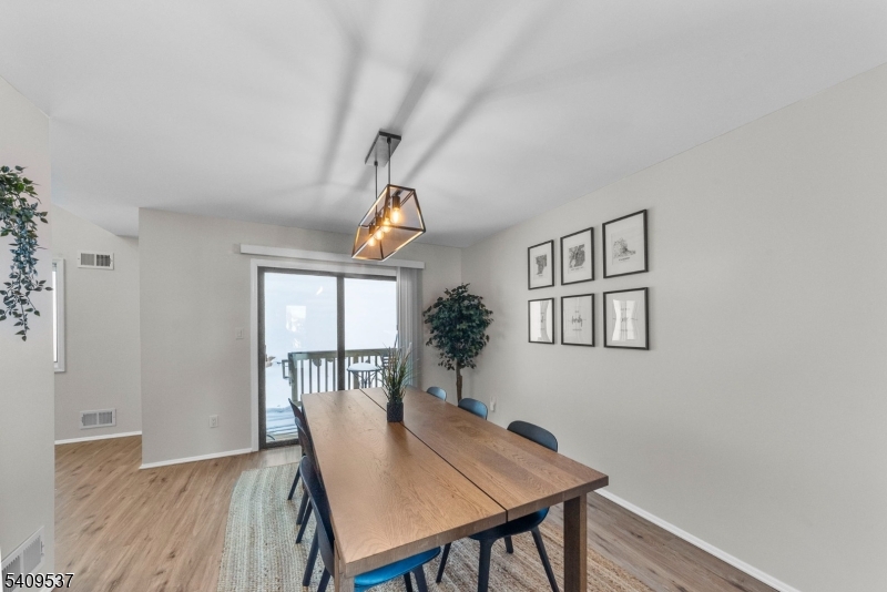 23 Bayowski Road West Orange, NJ 07052 - Photo 8 of 38 a view of a dining room with furniture window and wooden floor