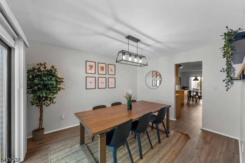 23 Bayowski Road West Orange, NJ 07052 - Photo 9 of 38 a view of a dining room with furniture and wooden floor