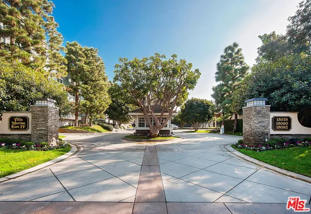 a view of a patio with a yard