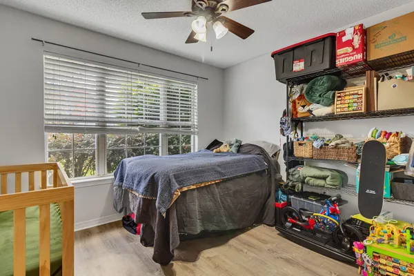 a bed room with a bed and a window