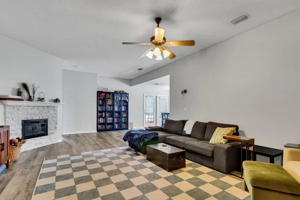 a living room with furniture and a fireplace