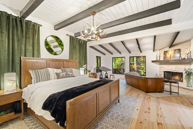 a bedroom with a bed and a television