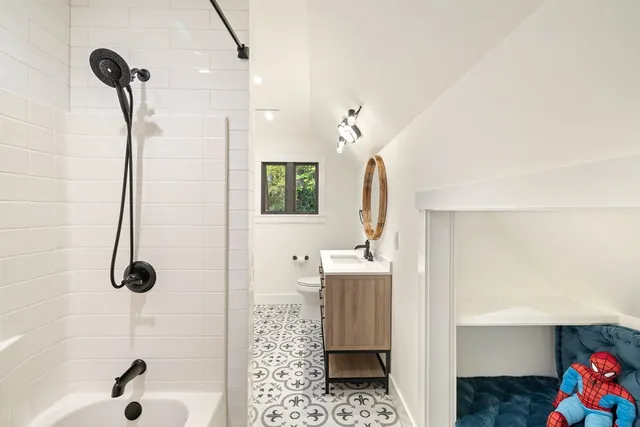 a living room with furniture a window and gym equipment